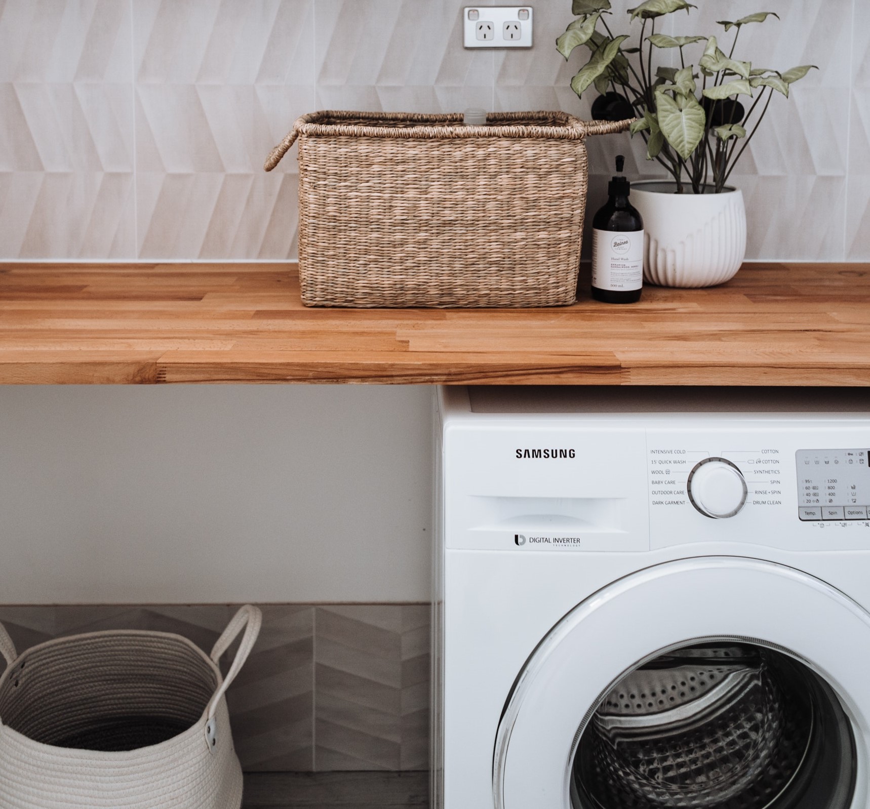 a clothes dryer in a wash room