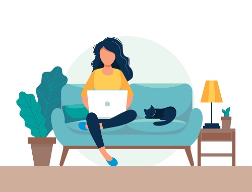 woman sitting on couch with laptop next to cat
